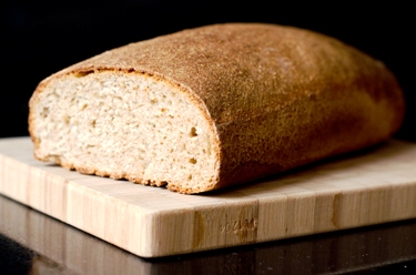 Pictured is a traditional, wholesome loaf of bread by an unknown Dutch photographer.